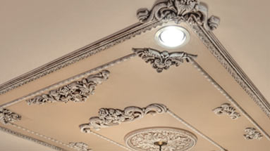 Decorative moldings and accents installed on ceiling
