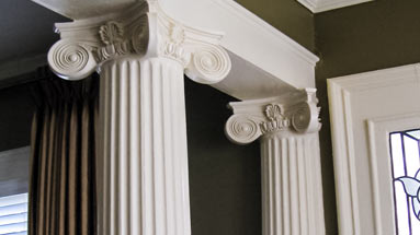 Decorative columns around support beam